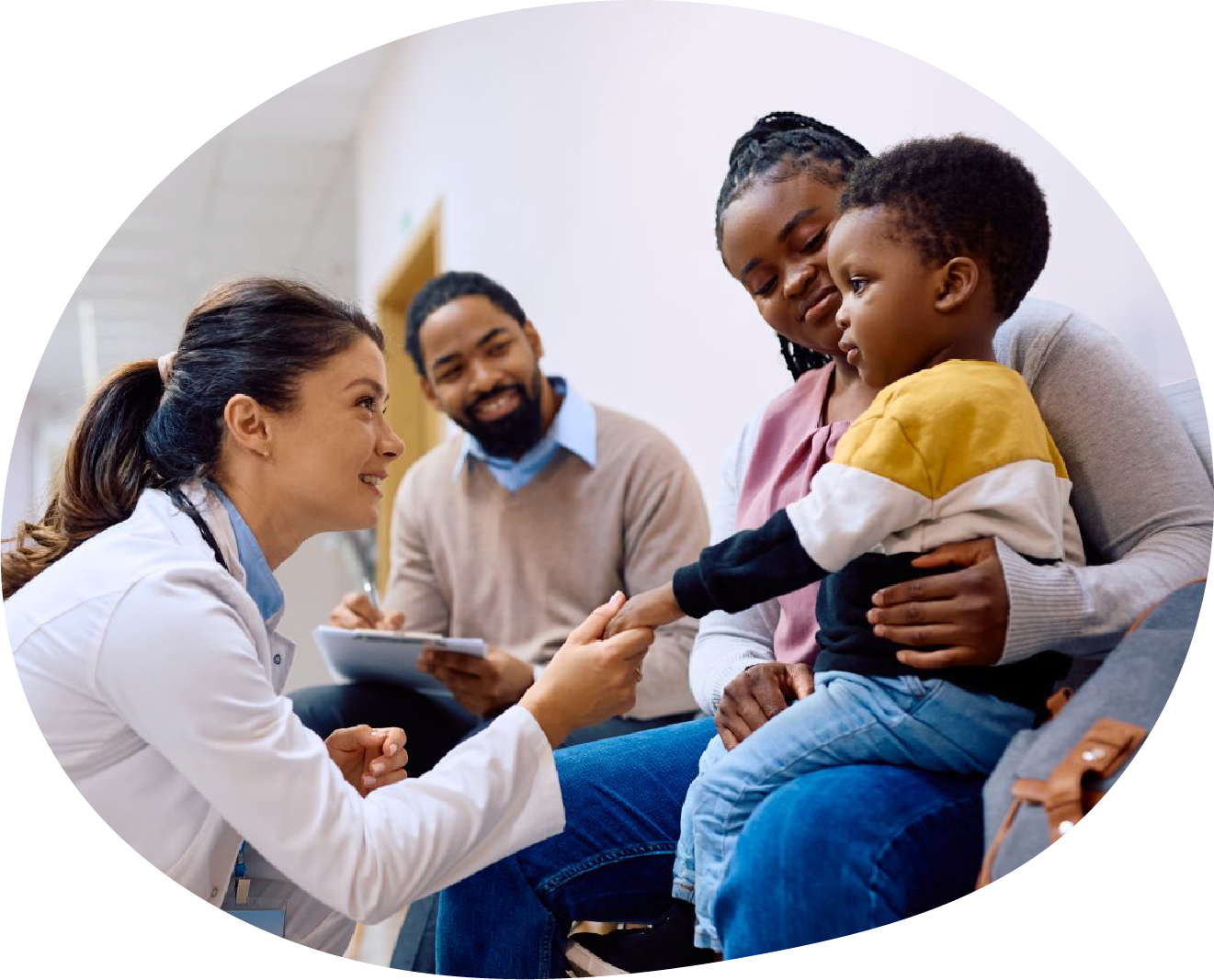 compass-pediatrician Pediatrician speaking with parents and young child