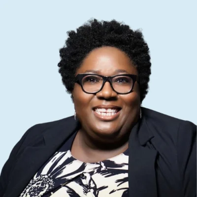 Altheria Caldera headshot with blue background