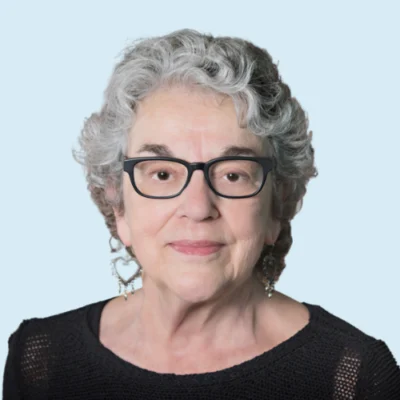 Anita Archer headshot with blue background