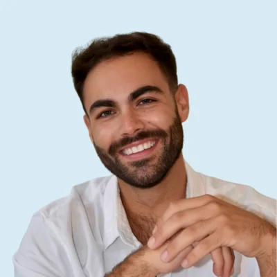 Brennan Chandler headshot with blue background