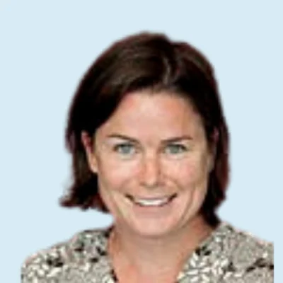 Cara McDermott headshot with blue background