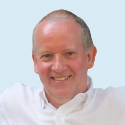 Charles Hulme headshot with blue background