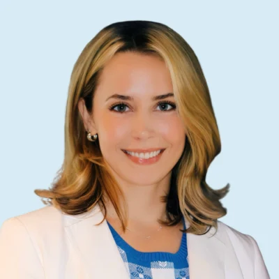 Claire Gunner headshot with blue background