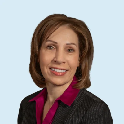 Dawn Brookhart headshot with blue background