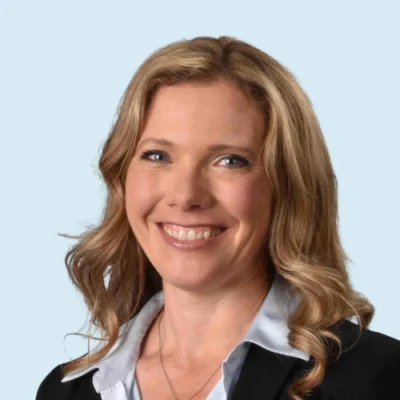 Doreen Mazzye headshot with blue background