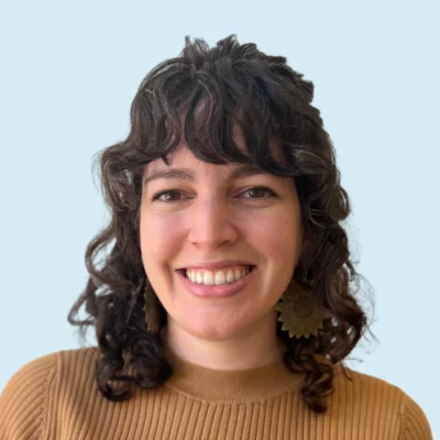 Francesca Smith headshot with blue background