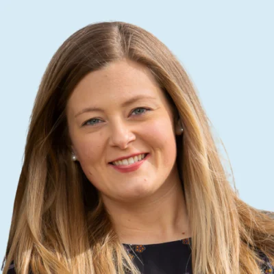 Heather Ballantine headshot with blue background