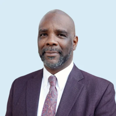 Kareem Weaver headshot with blue background