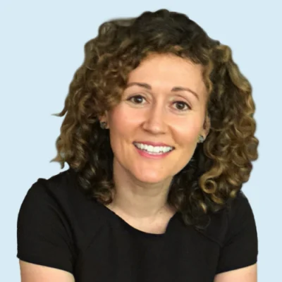 Katie Pace Miles headshot with blue background