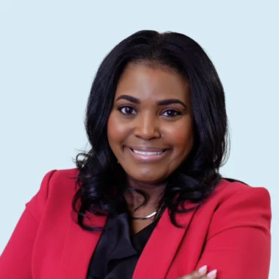 Kymyona Burk headshot with blue background