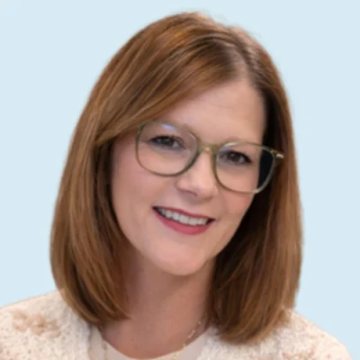 Michelle Goaley headshot with blue background