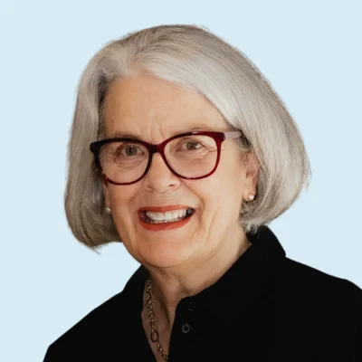 Pamela Snow headshot with blue background