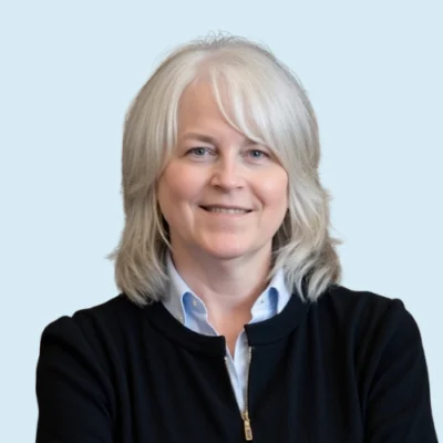 Rebecca Miles headshot with blue background