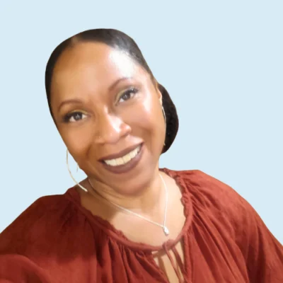 Renata Archie headshot with blue background