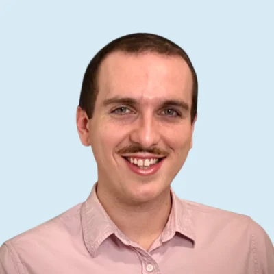 Ryan Buggy headshot with blue background