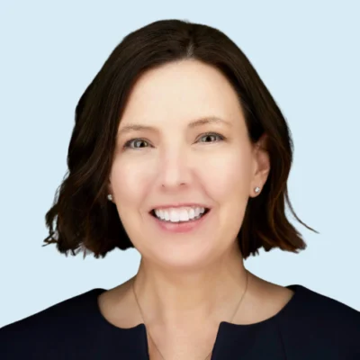 Sarah Brown headshot with blue background