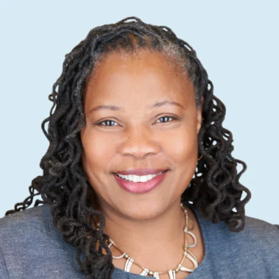 Zaretta Hammond headshot with blue background