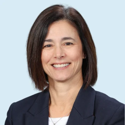 Carolyn Turner headshot with blue background