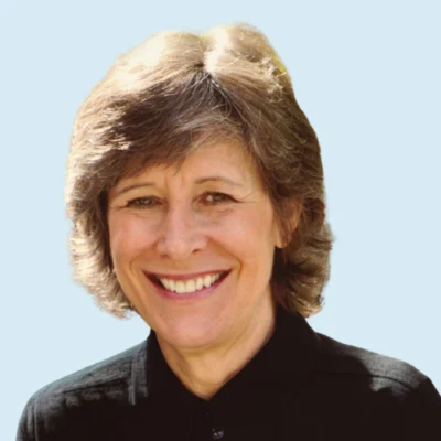 Lucy Hart Paulson headshot with blue background