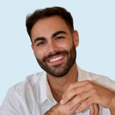 Brennan Chandler headshot with blue background