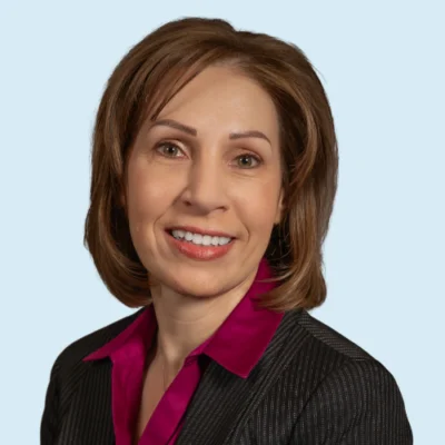 Dawn Brookhart headshot with blue background