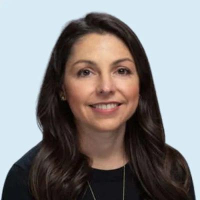 Jill Pentimonti headshot with blue background