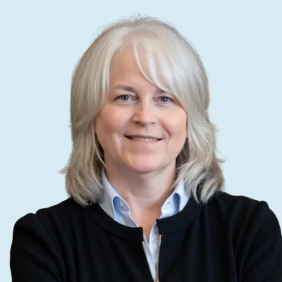 Rebecca Miles headshot with blue background