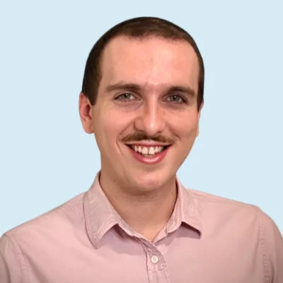 Ryan Buggy headshot with blue background